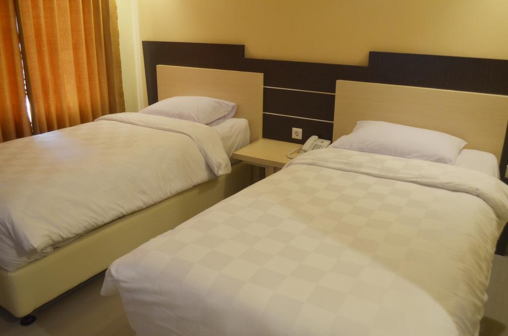 M Hotel Матарам Стая снимка